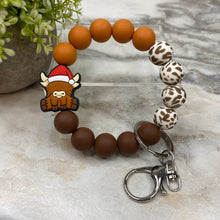 Load image into Gallery viewer, Silicone Bracelet Keychain -  Christmas Brown Highland Cow
