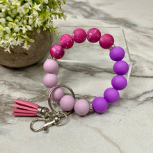 Load image into Gallery viewer, Silicone Bracelet Keychain - Purple Magenta Galaxy
