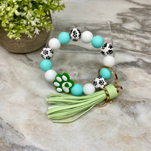 Load image into Gallery viewer, Silicone Bracelet Keychain - Turquoise Green Paw Print
