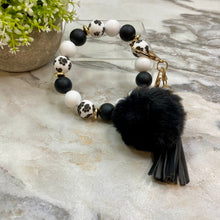 Load image into Gallery viewer, Silicone Bracelet Keychain - Tassel &amp; Pom Pom- Black &amp; White Paw
