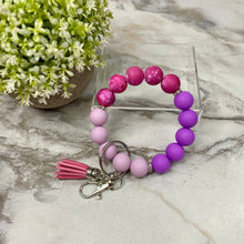 Load image into Gallery viewer, Silicone Bracelet Keychain - Purple Magenta Galaxy
