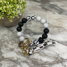 Load image into Gallery viewer, Silicone Bracelet Keychain - Cow + Black + Grey
