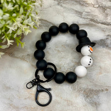 Load image into Gallery viewer, Silicone Bracelet Keychain with Tassel - Christmas - Black Hat Snowman
