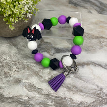 Load image into Gallery viewer, Silicone Bracelet Keychain - Halloween Green + Purple Bat
