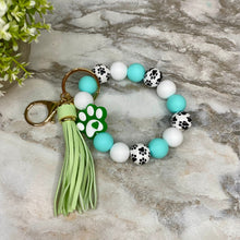 Load image into Gallery viewer, Silicone Bracelet Keychain - Turquoise Green Paw Print
