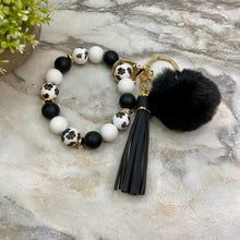 Load image into Gallery viewer, Silicone Bracelet Keychain - Tassel &amp; Pom Pom- Black &amp; White Paw
